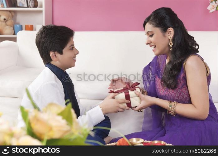 Brother giving gift to his sister at Raksha Bandhan