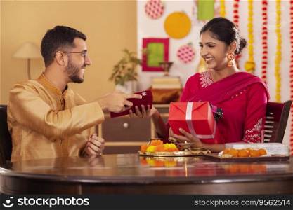 Brother giving gift to his sister on the occasion of Raksha Bandhan