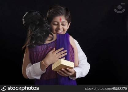 Brother hugging his sister at Raksha Bandhan