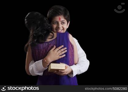 Brother hugging his sister at Raksha Bandhan