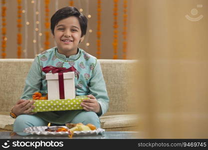 brother sitting with presents for his sister