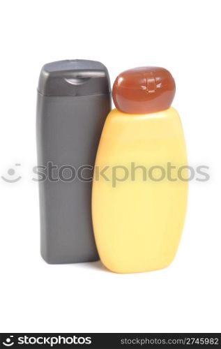 brown and orange sunscreen bottles isolated over the white background