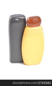 brown and orange sunscreen bottles isolated over the white background