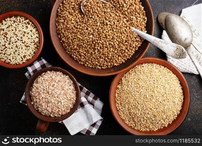 brown and white rice in bowls on a table
