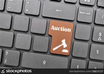 Brown auction key on keyboard
