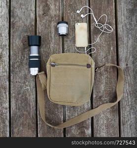 brown bag with accessories for travel in the nature