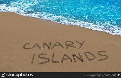 Brown beach sand with written word Canary islands