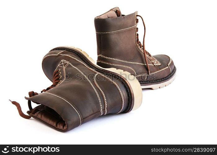 Brown boots isolated on white background.