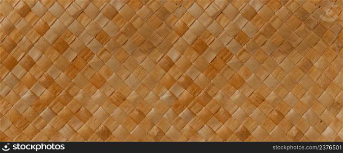 Brown braided reed texture. Closeup background. Horizontal banner. Brown braided reed texture background