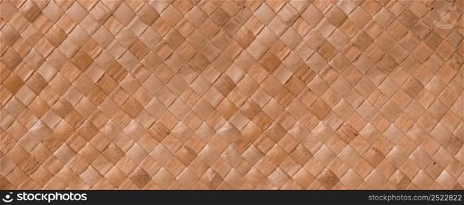 Brown braided reed texture. Closeup background. Horizontal banner. Brown braided reed texture background