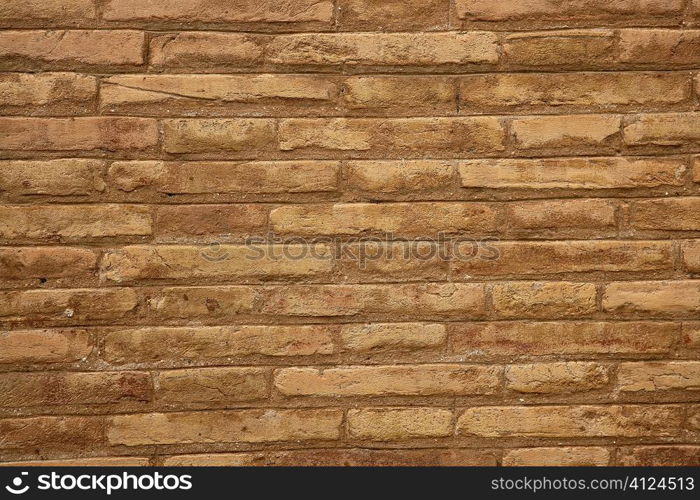 Brown brick wall in cream beige color pattern background