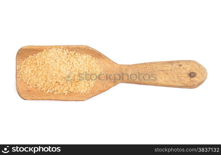 Brown cane sugar on shovel