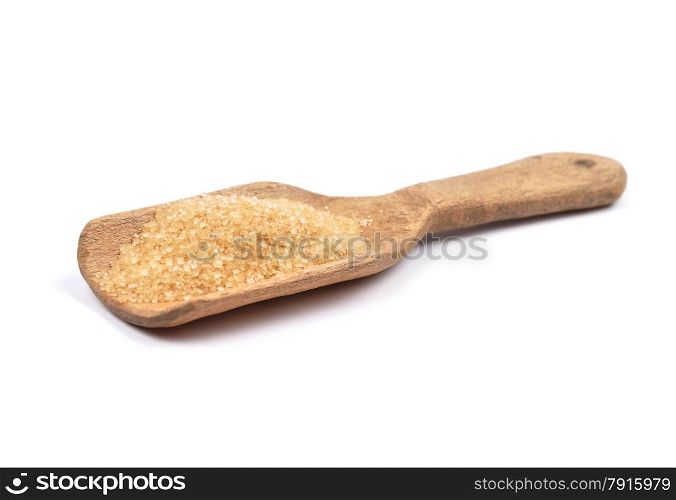 Brown cane sugar on shovel
