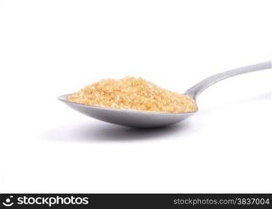Brown cane sugar on spoon
