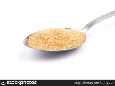 Brown cane sugar on spoon