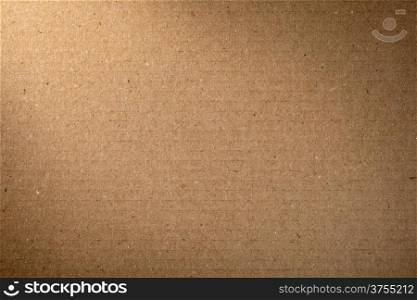 Brown cardboard texture for background, lighting from the left corner
