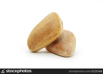 Brown cedar nuts fruit on white background