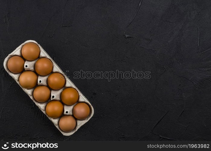 brown chicken eggs rack black table. High resolution photo. brown chicken eggs rack black table. High quality photo