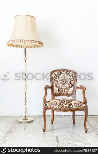 Brown Classical style sofa in vintage room with desk lamp