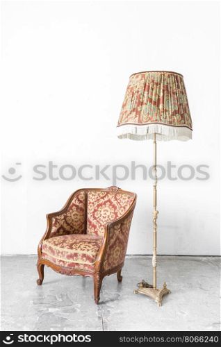 Brown Classical style sofa in vintage room with desk lamp