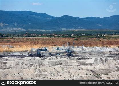 Brown coal open pit landscape with enormous digging excavator in Matra mine Hungary, east of Budapest. Brown coal open pit landscape with digging excavator in Hungary