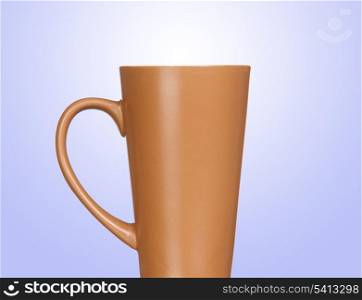 Brown coffee cup isolated on blue background