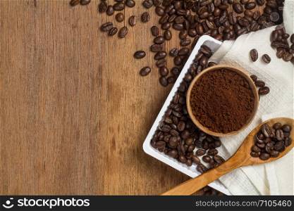 brown coffee powder and bean on wood table