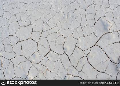 Brown color dry cracked muddy earth . Brown color dry cracked muddy earth as a background texture