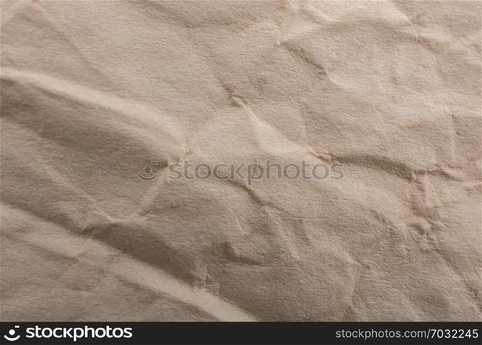 Brown color wrinkled paper as a background