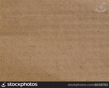 Brown corrugated cardboard background. Brown corrugated cardboard texture useful as a background