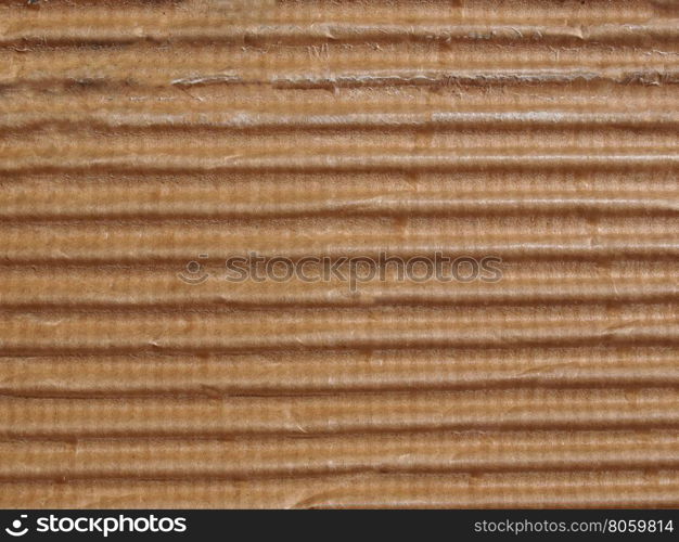 Brown corrugated cardboard background. Brown corrugated cardboard texture useful as a background