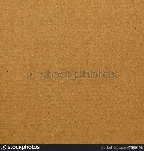 Brown corrugated cardboard background. Brown corrugated cardboard useful as a background