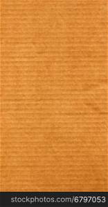 Brown corrugated cardboard background - vertical. Brown corrugated cardboard useful as a background - vertical