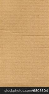 Brown corrugated cardboard texture background - vertical. Brown corrugated cardboard texture useful as a background - vertical