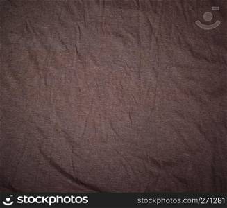 brown crumpled cotton stretching soft fabric, full frame