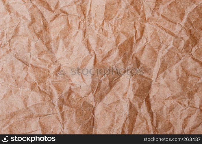 Brown crumpled folded paper for background or backdrop