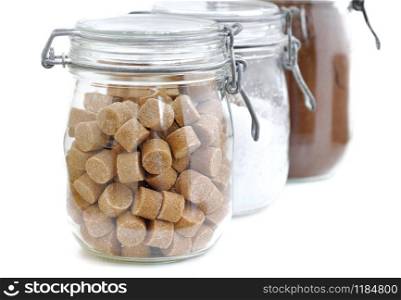 brown cube sugar in a retro jar isolated on white background