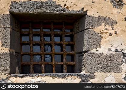 brown distorted castle window in a broke wall arrecife lanzarote spain