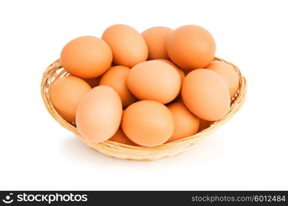 Brown eggs in the basket on white