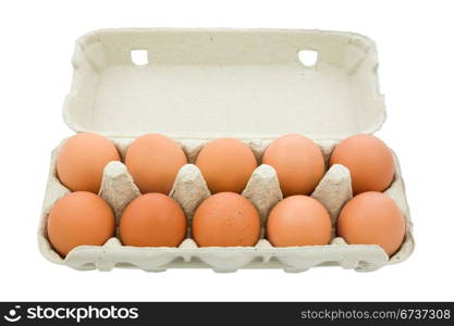 Brown eggs in the box isolated on white background