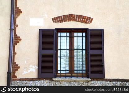 brown europe italy lombardy in the milano old window closed brick abstract grate