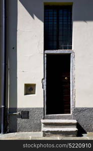 brown europe italy lombardy in the milano old window closed brick abstract grate door terrace