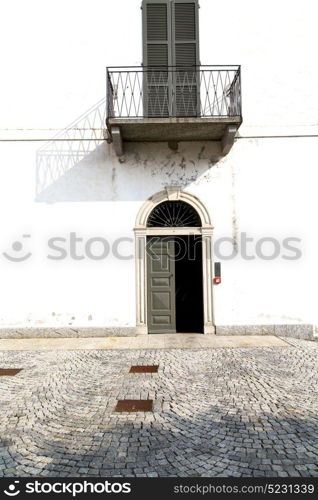 brown europe italy lombardy in the milano old window closed brick abstract grate door terrace