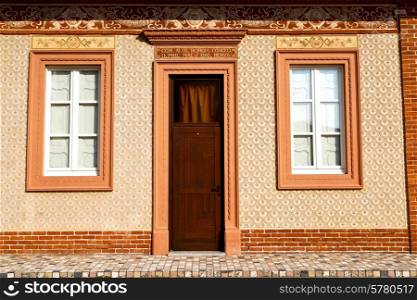 brown europe italy lombardy in the milano old window closed brick abstract grate door terrace