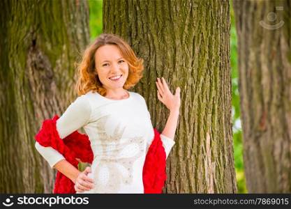 brown-eyed red-haired beautiful girl portrait in the park