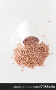 Brown flax seed on clean kitchen table, stock photo