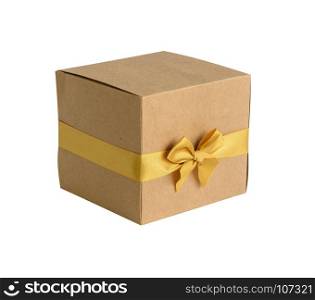 Brown gift box with gold bow isolated on white background
