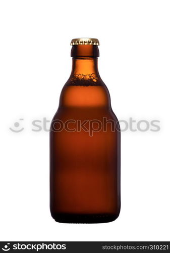 Brown glass beer bottle with yellow cap isolated on white