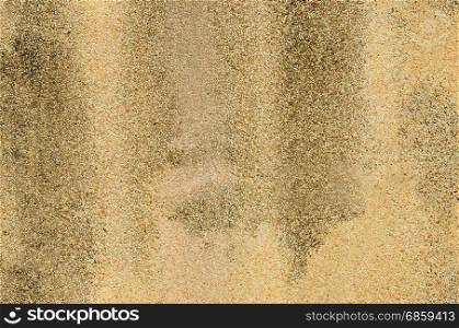 brown gravel wall surface with stains
