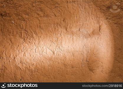 brown grungy background with spot of light